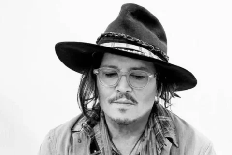 Johnny Depp takes a bite of fake plants at a party in Las Vegas