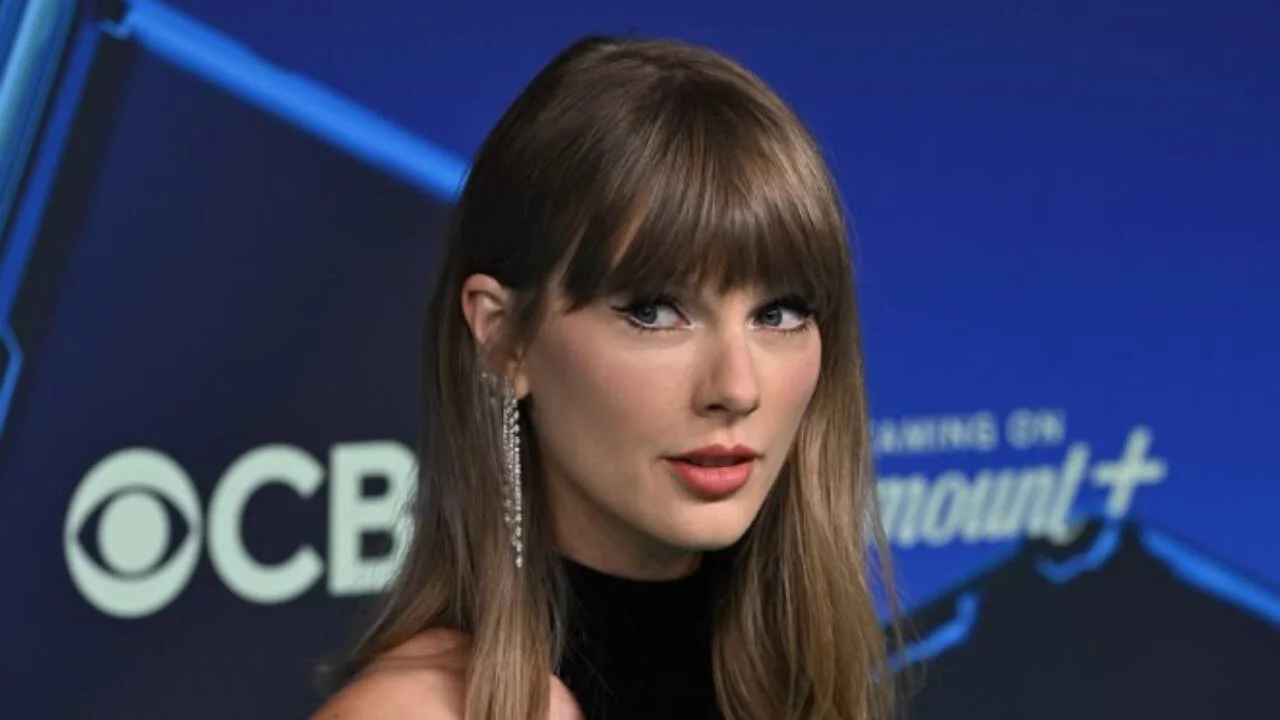 Taylor Swift attends MTV VMAs in 2026 in a black and silver floor-length dress